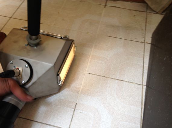 cleaning tile grout with vacuum blast method