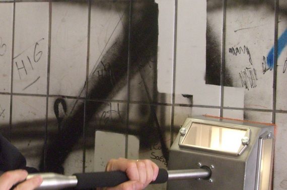 removing graffiti professional with cleaning machine at a motorway cleaning equipment at motorway