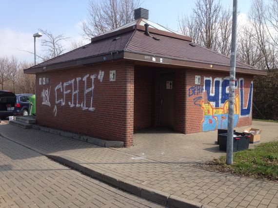 removing graffiti professional at a motorway