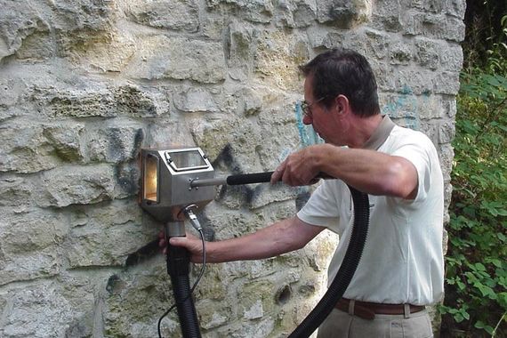 removing graffiti on exterior wall