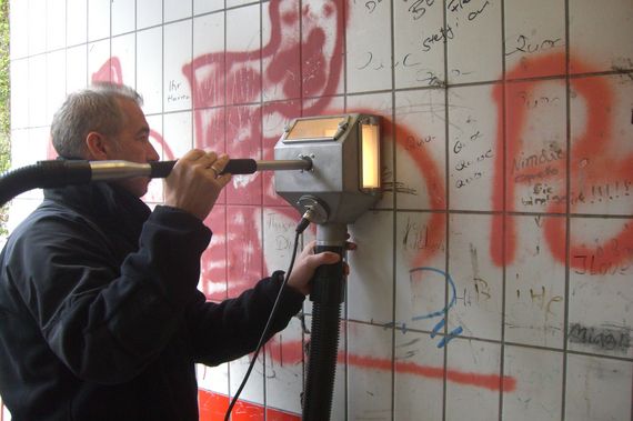 graffiti removal on tile with green cleaning machine